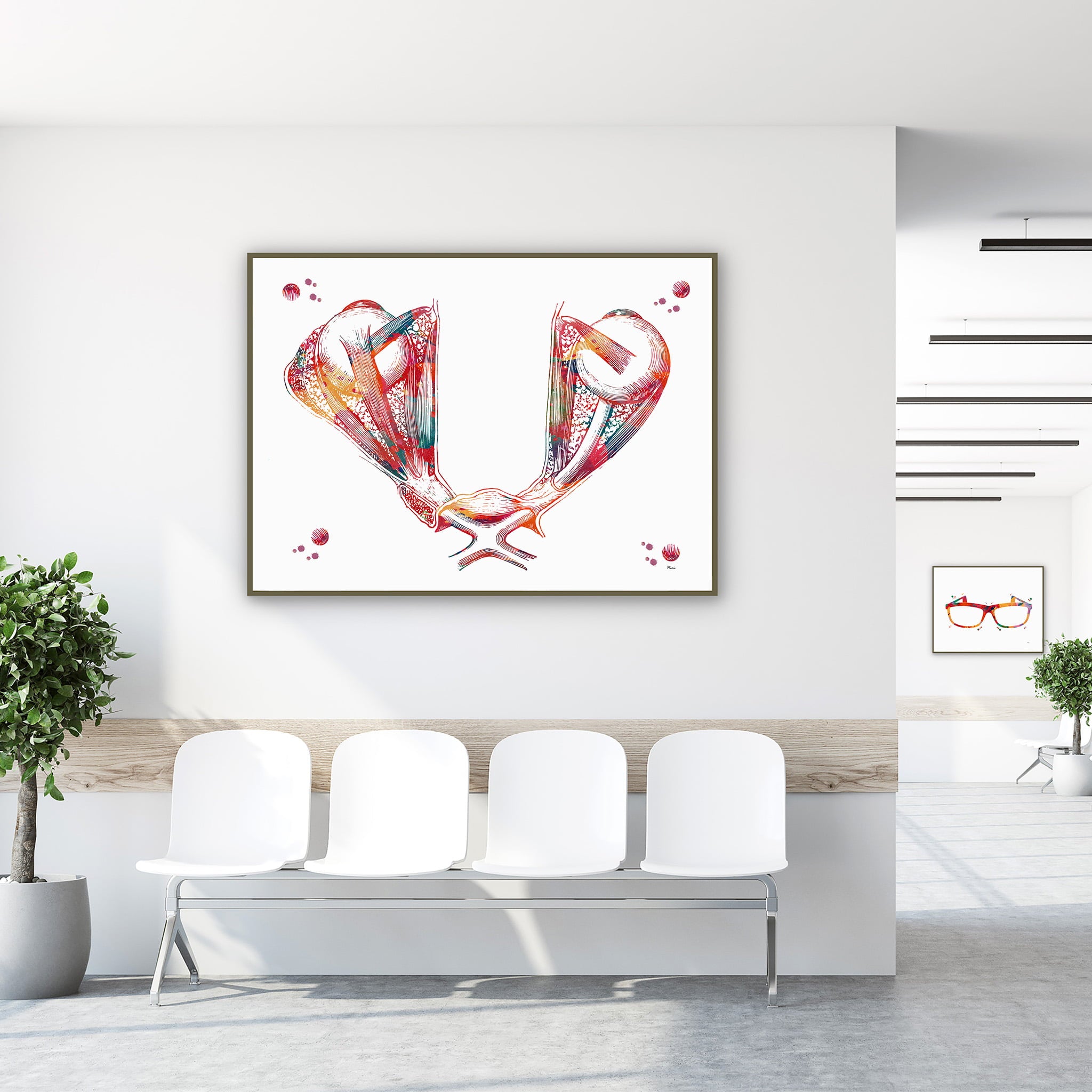 Framed optic chiasm eye & brain anatomy watercolor print in a clinic waiting room