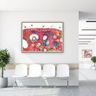 Framed ovary cross-section histology watercolor print in a clinic waiting room