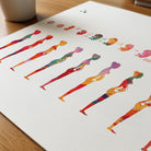 Close-up of pregnancy phases of fetal development watercolor print showing paper texture and grain