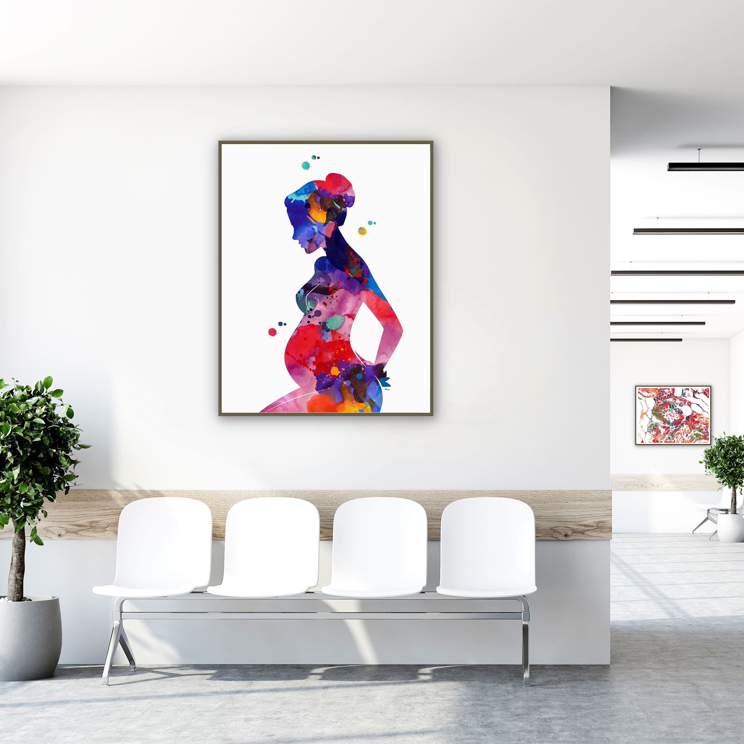 Framed pregnant woman motherhood watercolor print in a clinic waiting room
