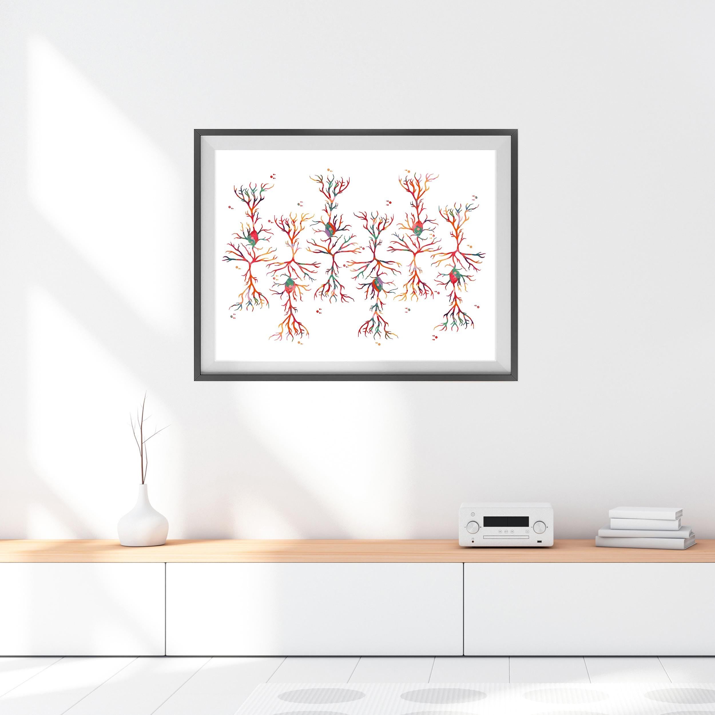 Framed artwork of neural networks on a white wall above a wooden shelf.