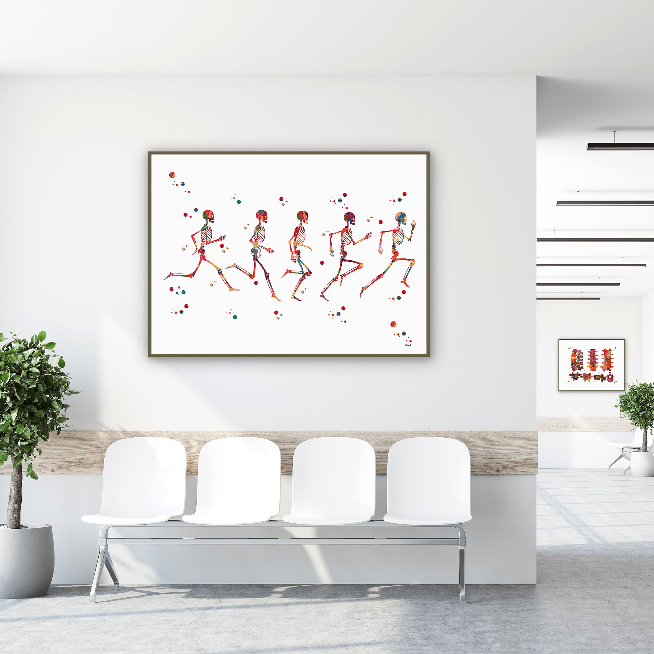 Framed running phases anatomy watercolor print in a clinic waiting room