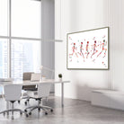 Framed running phases anatomy watercolor print in an orthopedic clinic