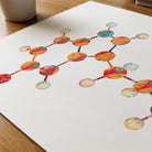 Close-up of serotonin molecular structure watercolor print showing paper texture and grain