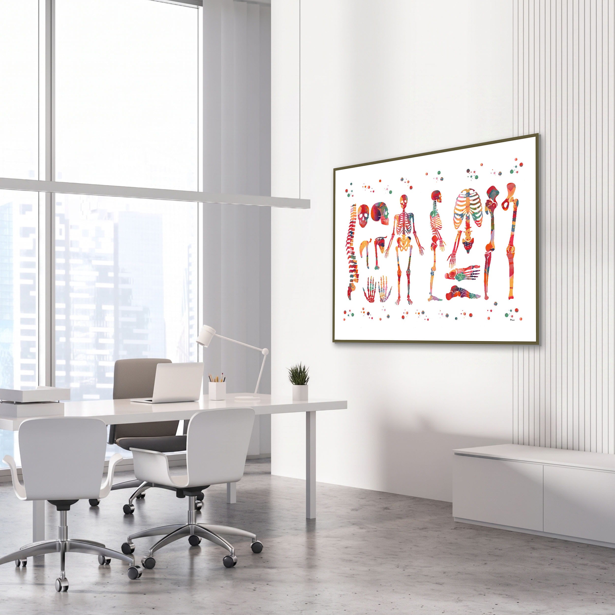 Framed skeletal system anatomy watercolor print in an orthopedic clinic