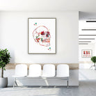 Framed skull anatomy watercolor print in a clinic waiting room