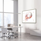 Framed skull lateral view watercolor print in a clinic waiting room