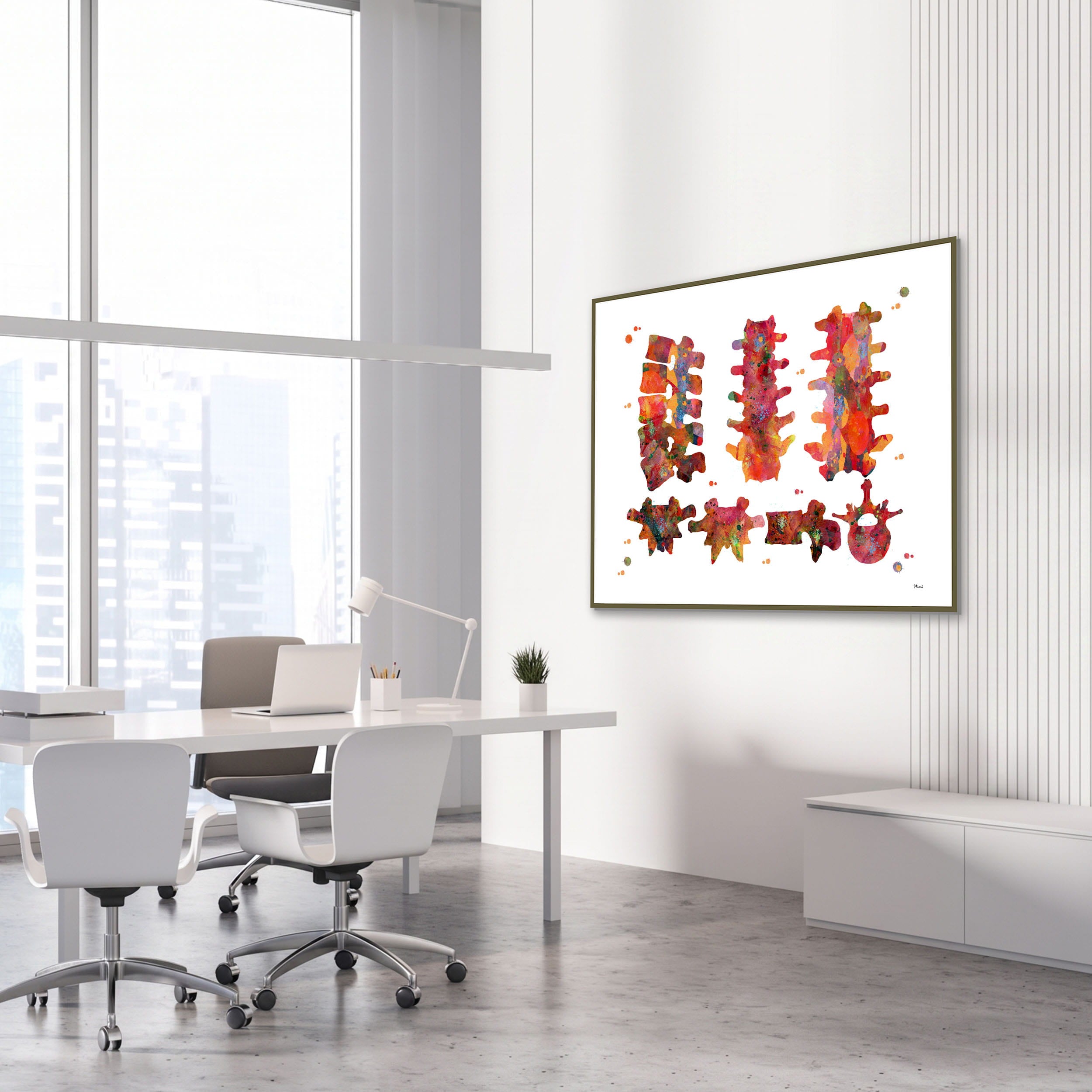 Framed vertebral bones anatomy watercolor print in an orthopedic clinic