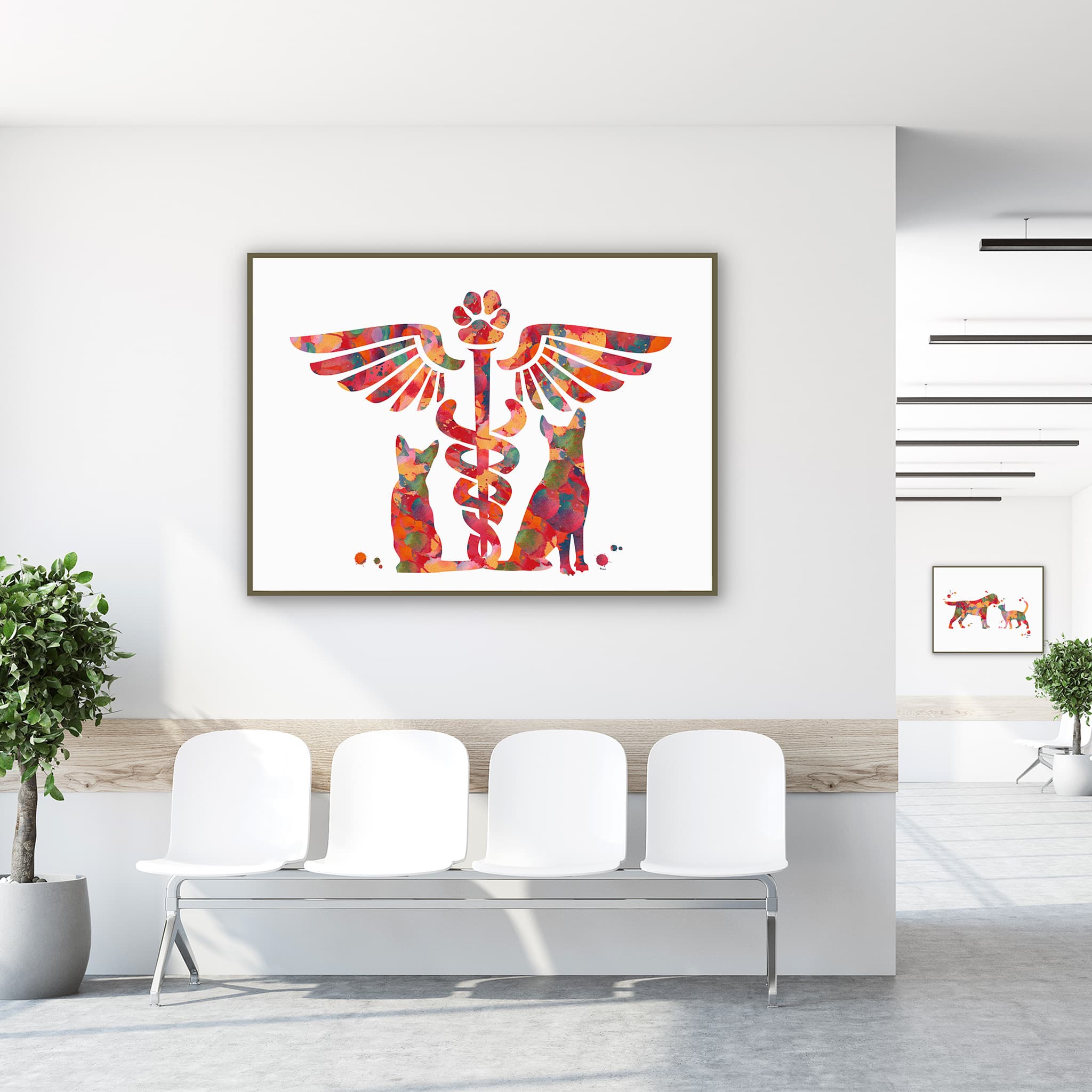 Framed vet caduceus cat & dog watercolor print in a clinic waiting room