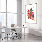 Framed vibrant abstract anatomical heart watercolor print in a cardiology clinic