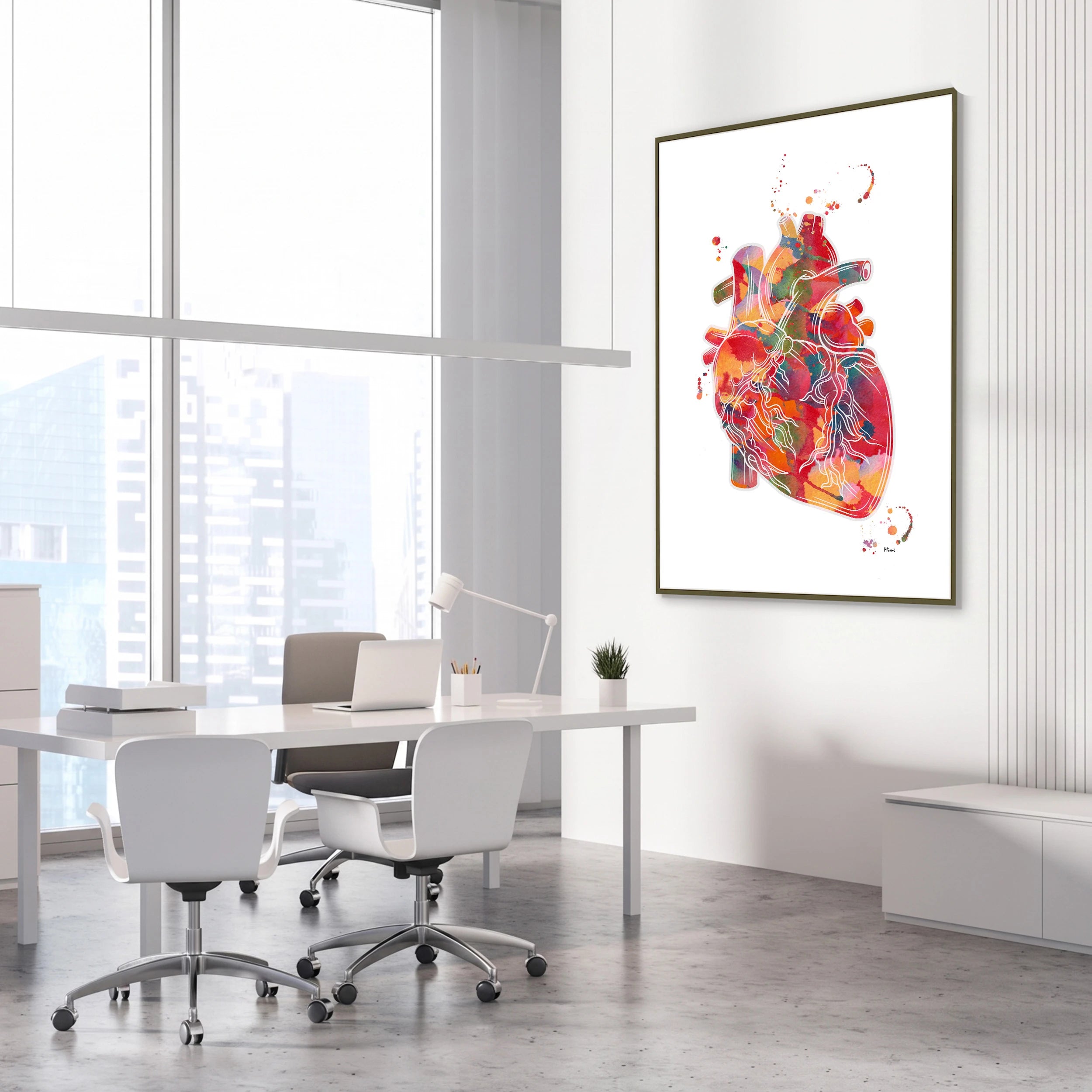 Framed vibrant abstract anatomical heart watercolor print in a cardiology clinic