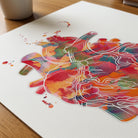 Close-up of vibrant abstract anatomical heart watercolor print showing paper texture and grain